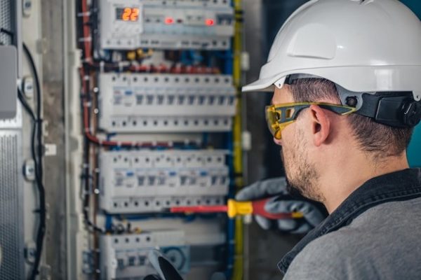 A man is checking surge protection devices