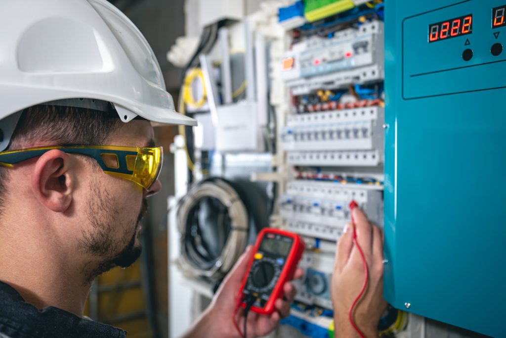a man is testing a breaker